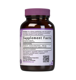 An amber glass supplement bottle with a purple cap and a white label featuring a purple 'Supplement Facts' panel, shown on a plain white background.