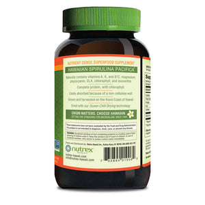 Nutrex Spirulina Pacifica supplement bottle with green cap on a white background